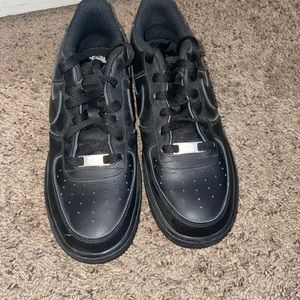 Nike Air force One’s black. Only worn once. Size 7Y boys which is 7 in women.